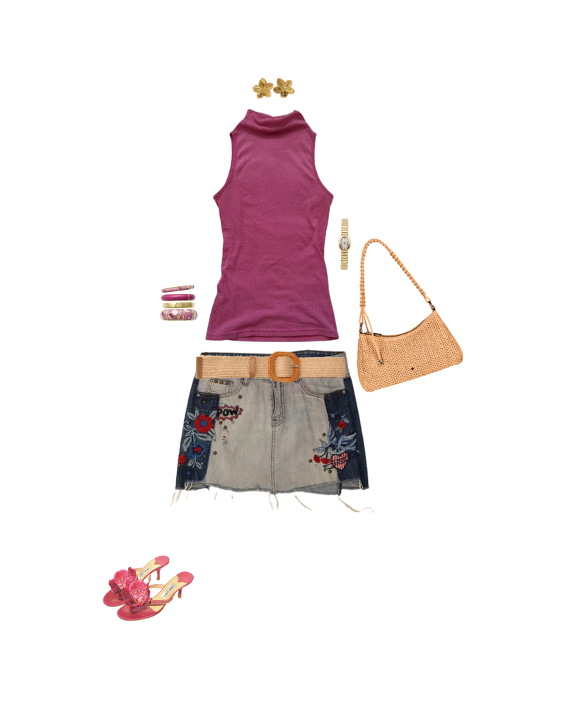 A flat-lay outfit arrangement on a white background featuring a sleeveless magenta turtleneck top, a denim mini skirt with floral embroidery and a tan belt, a woven tan shoulder bag, pink floral heeled sandals, a gold watch, gold earrings, and stacked bracelets.